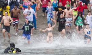 Polar Plungers Jumping in Water at 2018 Special Olympics Washington Polar Plunge